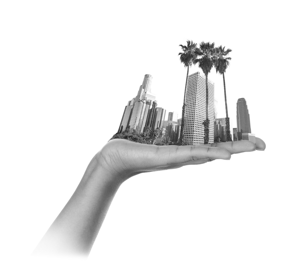 Grayscale image of hand holding the city of LA